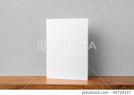front view of greeting card on bookshelf and grey front view of greeting card on bookshelf and grey 49729337