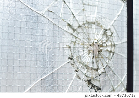 Broken window glass 49730712