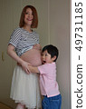 Pregnant woman and boy 49731185