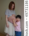 Pregnant woman and boy 49731186