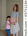 Pregnant woman and boy 49731240