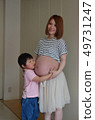 Pregnant woman and boy 49731247