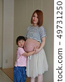 Pregnant woman and boy 49731250