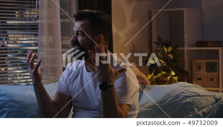 Couple having late night argument 49732009