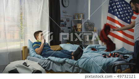 Angry father arguing with his son 49732121