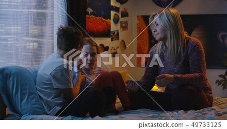 Mother talking with bickering siblings 49733125