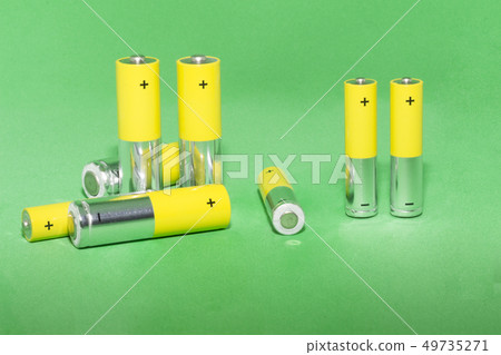 AA batteries on green background. Concept of recycling 49735271