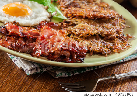 Hash browns. Potato pancakes with crispy fried Hash browns. Potato pancakes with crispy fried 49735905