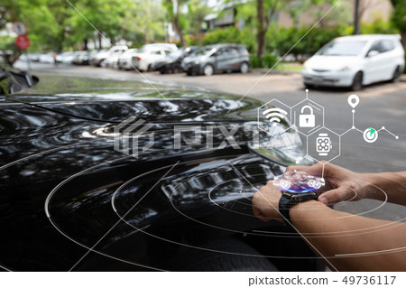 Man using smart watch connecting car 49736117