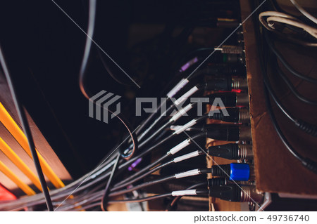 Audio jack cable connected at rear end of mixer at broadcasting,shallow depth of field. Audio jack cable connected at rear end of mixer at broadcasting,shallow depth of field. 49736740