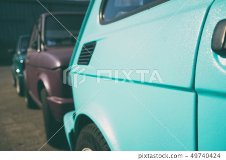 Three cars standing in a row on the road Three cars standing in a row on the road 49740424