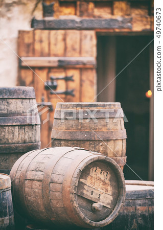 Antique oak barrels with steel hoops Antique oak barrels with steel hoops 49740673