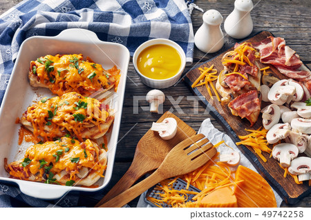 grilled chicken breasts in a baking dish grilled chicken breasts in a baking dish 49742258