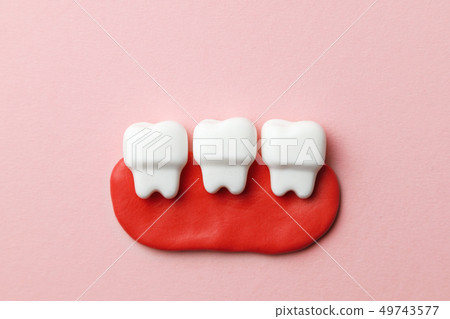 Healthy white teeth on pink background Healthy white teeth on pink background 49743577