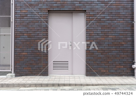 sidewalk by street wall & door sidewalk by street wall & door 49744324