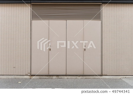 sidewalk by street wall & door sidewalk by street wall & door 49744341
