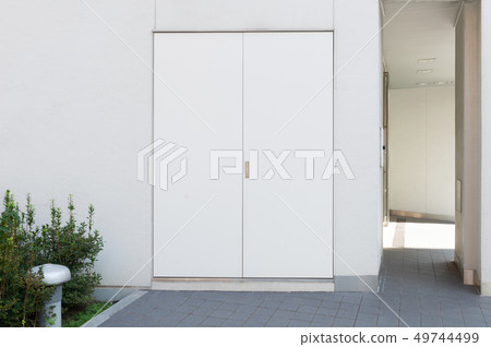 sidewalk by street wall & door sidewalk by street wall & door 49744499