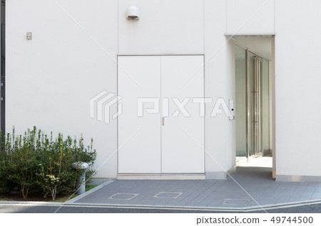 sidewalk by street wall & door sidewalk by street wall & door 49744500