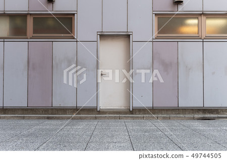 sidewalk by street wall & door sidewalk by street wall & door 49744505