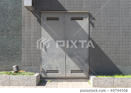 sidewalk by street wall & door sidewalk by street wall & door 49744506