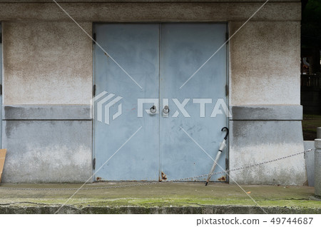 sidewalk by street wall & door sidewalk by street wall & door 49744687