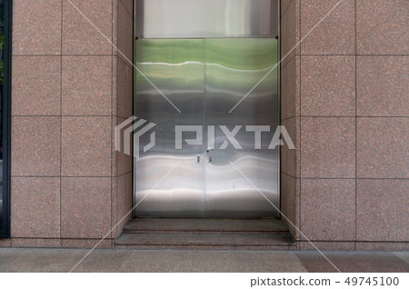 sidewalk by street wall & door sidewalk by street wall & door 49745100