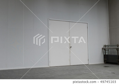 sidewalk by street wall & door sidewalk by street wall & door 49745103