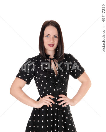 Pretty woman in a black dress standing from front Pretty woman in a black dress standing from front 49747239