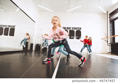 The kids at dance school. Ballet, hiphop, street, funky and modern dancers The kids at dance school. Ballet, hiphop, street, funky and modern dancers 49747487