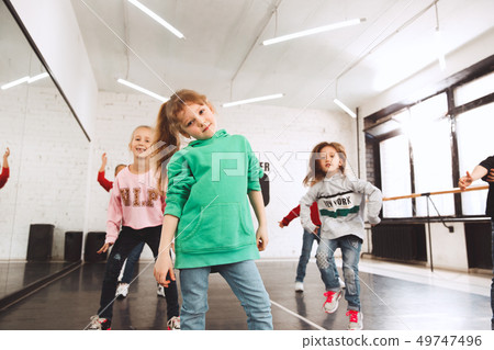 The kids at dance school. Ballet, hiphop, street, funky and modern dancers The kids at dance school. Ballet, hiphop, street, funky and modern dancers 49747496