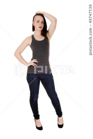 Woman with fancy hair standing in jeans Woman with fancy hair standing in jeans 49747539