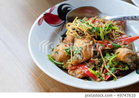 Stir deep fried fish with spicy herbs Stir deep fried fish with spicy herbs 49747610