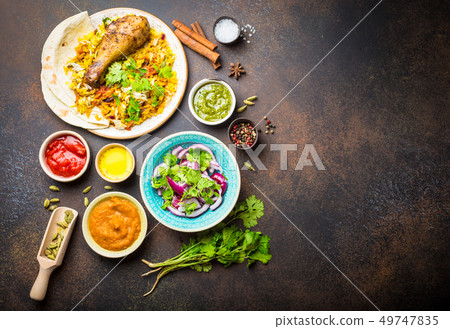 Biryani chicken and indian diches 49747835