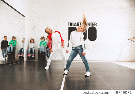 The kids at dance school. Ballet, hiphop, street, funky and modern dancers 49749071