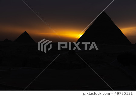 The pyramids at sunset, silhouettes in the dark, Giza, Egypt 49750151