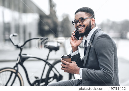 No time for break. Millennial businessman talking on phone No time for break. Millennial businessman talking on phone 49751422