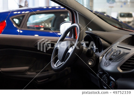 Interior of new car at dealer showroom. 49752339