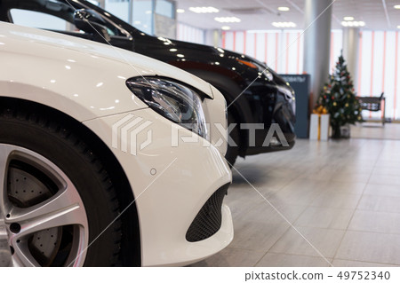 New cars at dealer showroom. Car auto dealership. 49752340