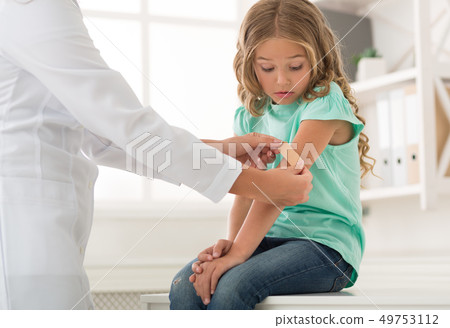 Shocked girl at doctor pediatrician in clinic Shocked girl at doctor pediatrician in clinic 49753112