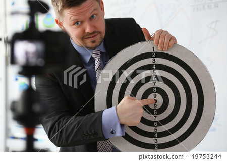 Male millennial vlogger hold target darst Male millennial vlogger hold target darst 49753244