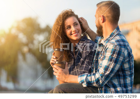 Romantic feelings. Delighted man touching her wife's hair 49753299