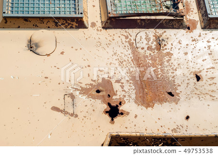 hole from anti-tank missile in armor of armored 49753538