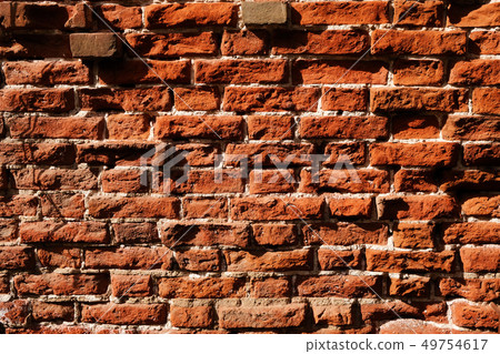 Old brown brick wall texture background 49754617