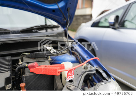 Car battery run-up and first aid Jumping start with booster cable 49756763