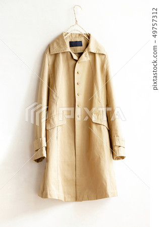 Beige trench coat on white background and hanger 49757312
