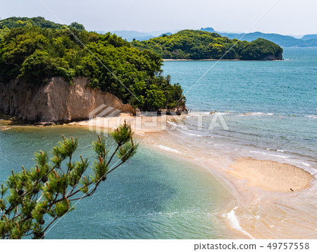 The stunning scenery of the sandy beach leading to Angel Road on Shodoshima Island in the Seto Inland Sea and the tombolo phenomenon. The stunning scenery of the sandy beach leading to Angel Road on Shodoshima Island in the Seto Inland Sea and the tombolo phenomenon. 49757558