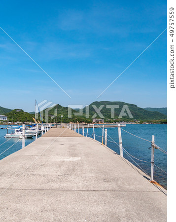 Shodoshima Angel Road Park and the Seto Inland Sea with fishing boats floating on the water - a clear, sunny landscape. Shodoshima Angel Road Park and the Seto Inland Sea with fishing boats floating on the water - a clear, sunny landscape. 49757559