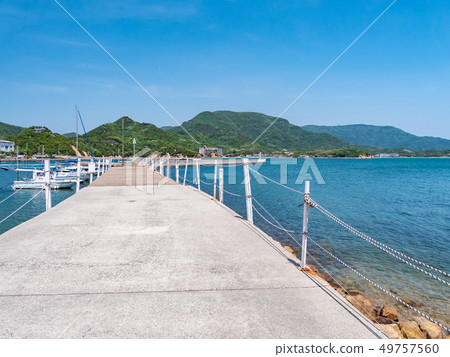 The Seto Inland Sea, with fishing boats visible on the sandy beach and breakwater along Angel Road on Shodoshima Island. The Seto Inland Sea, with fishing boats visible on the sandy beach and breakwater along Angel Road on Shodoshima Island. 49757560