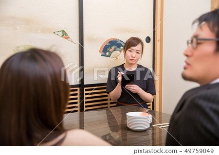 Staff in a pub that caters to customers 49759049