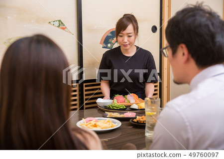 Tavern staff carrying food Tavern staff carrying food 49760097